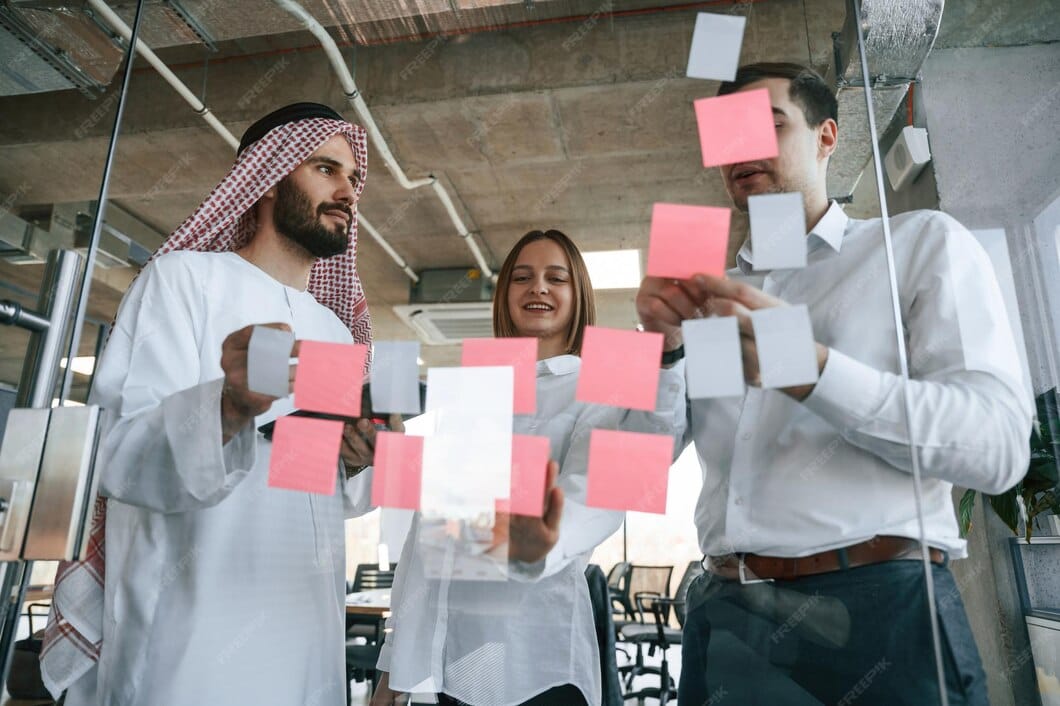 using-stickers-glass-muslim-businessman-traditional-outfit-with-colleagues-office